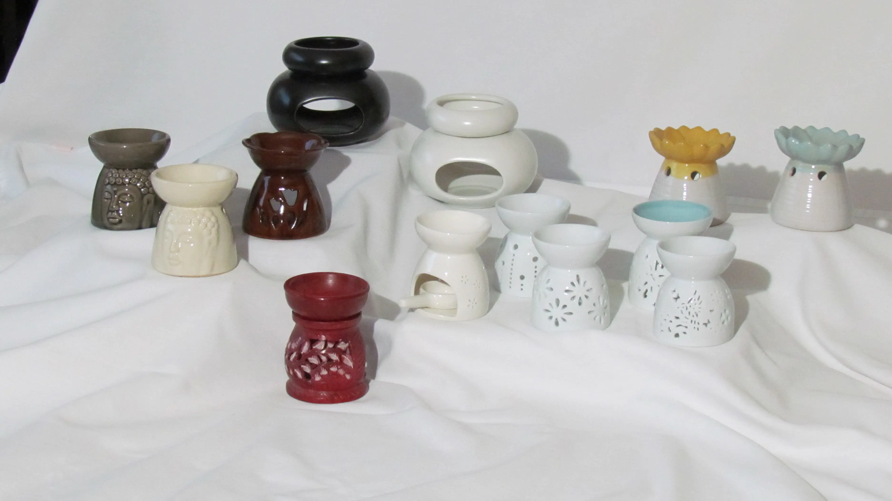Handcrafted Aromas DM soy candle glowing in a warm interior